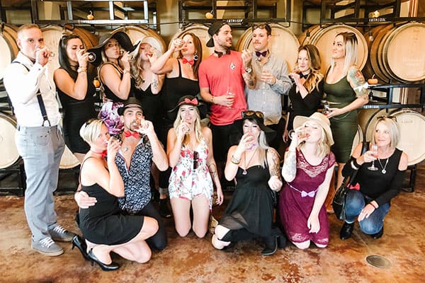 A group wine tasting in a winery on a Kelowna wine tour